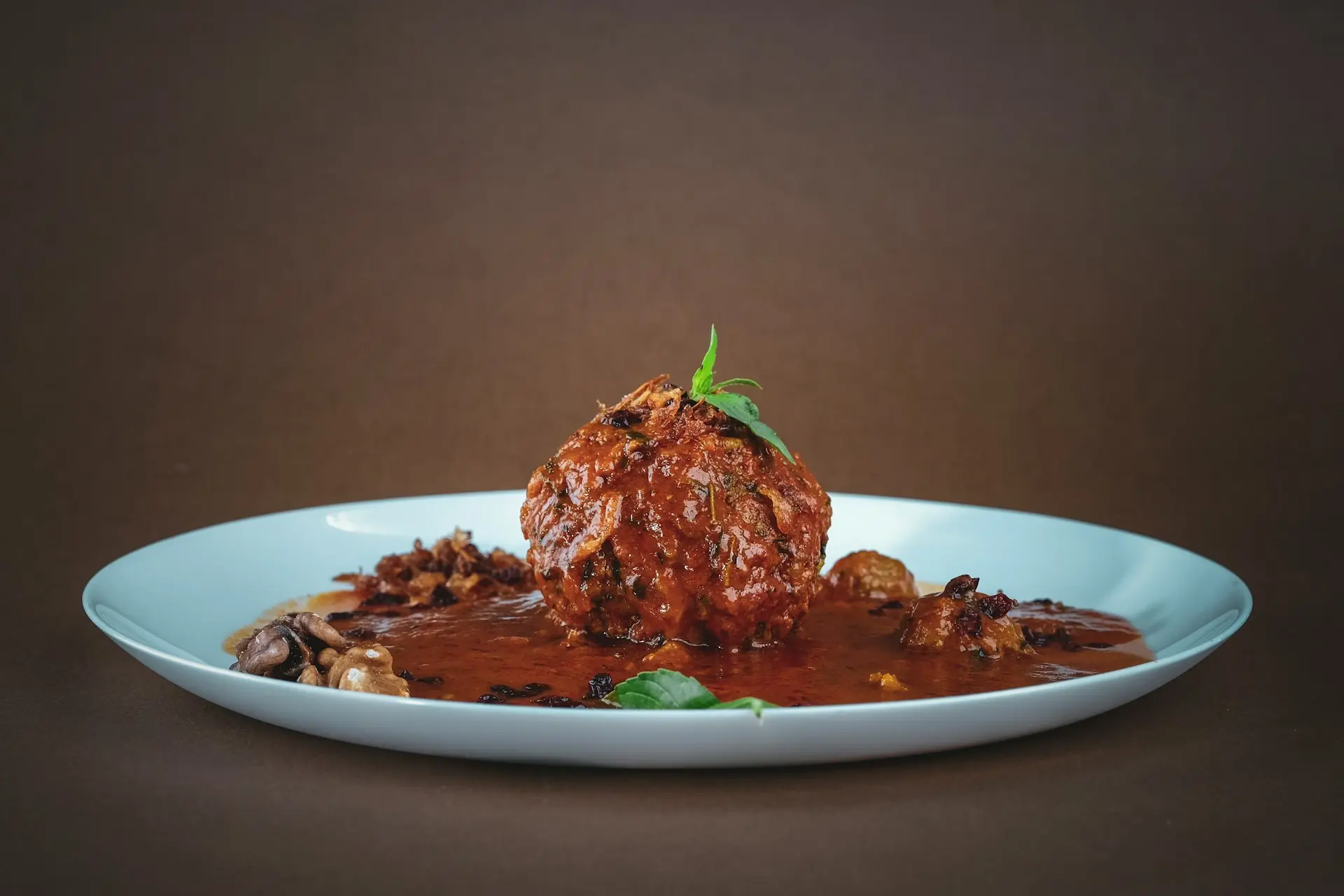 cooked meat on white ceramic plate